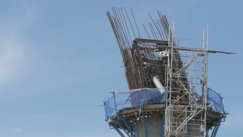 Construction of concrete suspension bridge supporting column, closeup Stock Footage 137872436
