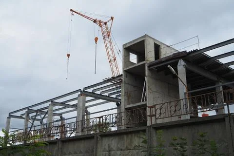 Construction. Construction of the building. The work of the crane. Stock Photos