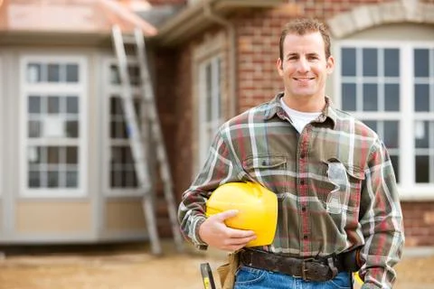 Construction: contractor in front of new home Stock Photos