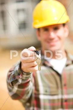Construction: contractor holding house key Stock Photos