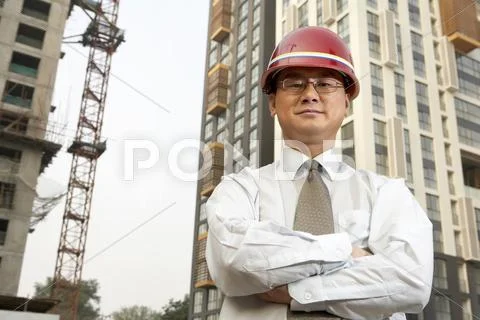 Construction Contractor Standing On Building Site Stock Photos