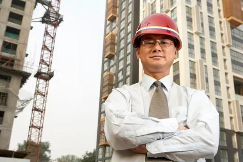 Construction Contractor Standing On Building Site Stock-Fotos