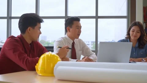 Construction contractor team is discussing on laptop computer in a engineer meet Stock Footage 138976983