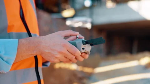 Construction, control or hands on worksite with drone, structure or progress Stock Footage 336219522
