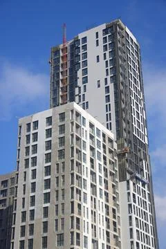 Construction cradle on the facade of a building under construction, new bui.. Stock Photos