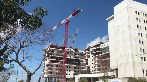 Construction crane against a beautiful sky. New buildings. Stock Footage 171622061