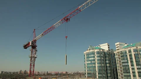 Construction crane against the blue sky and buildings Stock-Footage 38552145