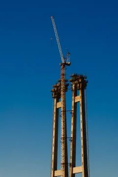 Construction crane against the blue sky, engineering construction, big Stock Photos