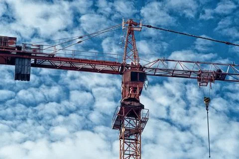 Construction crane against clouds 스톡 사진