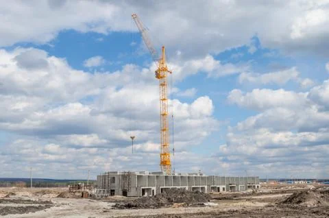 Construction crane against the sky with clouds Stock Photos