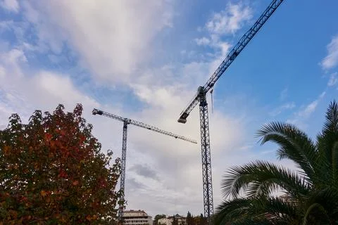 Construction crane against the sky. Stock Photos