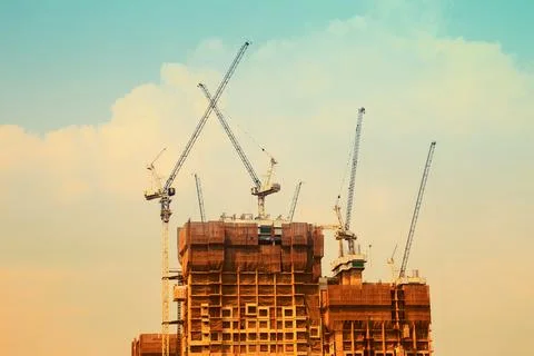 Construction crane and the building Stock Photos