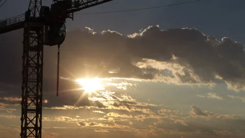 Construction crane and dramatic sunset time-lapse Stock Footage 147414057