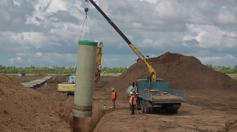Construction crane and excavator at the construction site Stock Footage 61586086