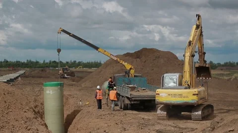 Construction crane and excavator at the construction site Stock-Footage 61586170