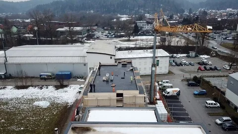 Construction crane and hydroisolation at a building rooftop Stock Footage 102161653