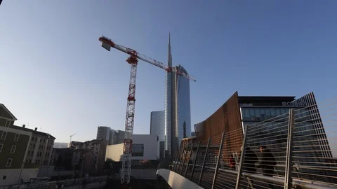 Construction crane and passing people Stock Footage 102000684