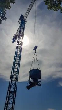 Construction crane on a background of blue sky. Close view of a construction Stock-Fotos