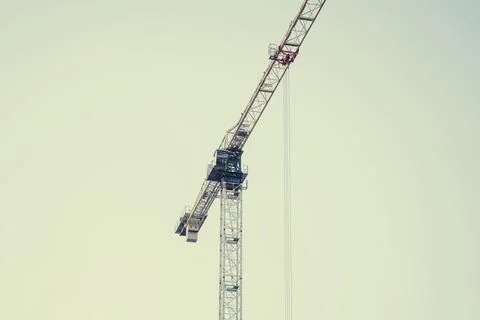Construction crane on the background of the sky. Construction site. Stock Photos