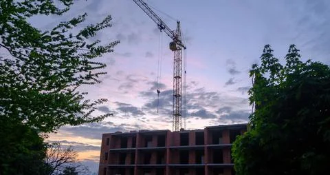 Construction crane on the background of the sky. Construction site. Industrial Stock Photos