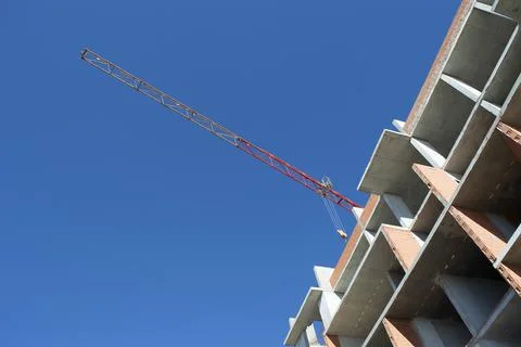 Construction crane on the background of the sky Stock Photos