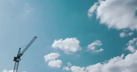 Construction crane on blue skies time-lapse Stock Footage 135040782