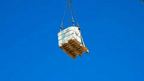 Construction crane on a blue sky background Stock Footage 305988570