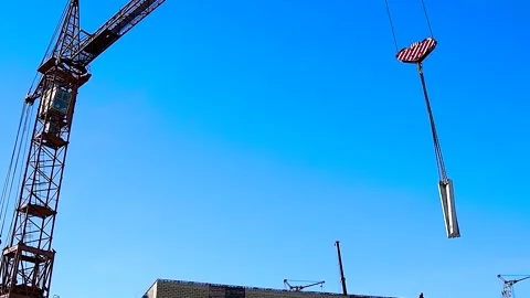 Construction crane on a blue sky background Stock Footage 310045269