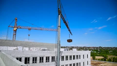 Construction crane on a blue sky background Stock Footage 310045595