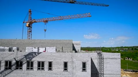 Construction crane on a blue sky background Stock Footage 310052678