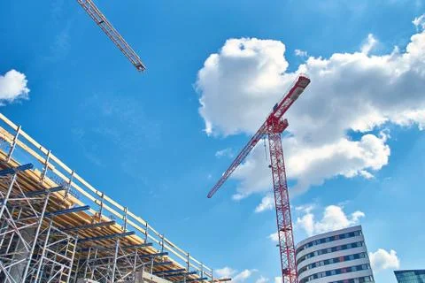 Construction crane on blue sky background Stock Photos