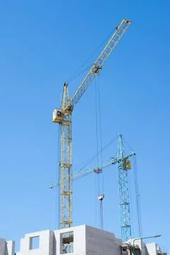 Construction crane on blue sky background Stock Photos