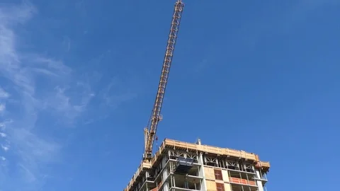 Construction crane blue sky building urban house Stock Footage 79496434