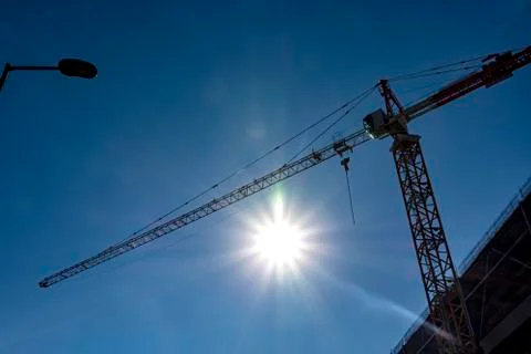 Construction crane on blue sky Stock Photos