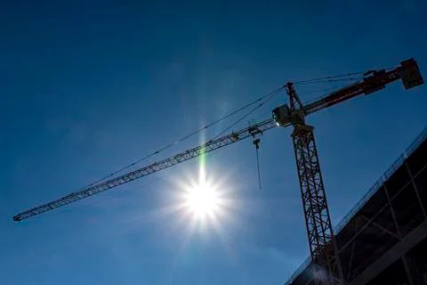 Construction crane on blue sky Stock Photos