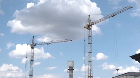 Construction crane on a building background. Territory of construction houses Stock Footage 129792016