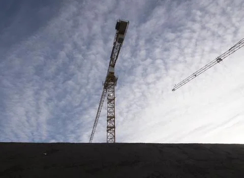 Construction crane in building industry Stock Photos