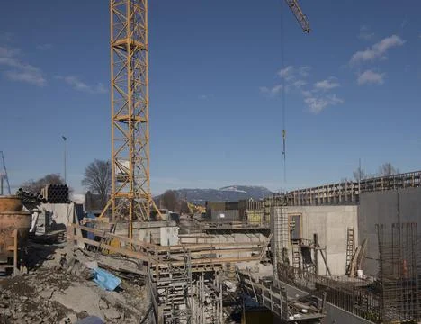 Construction crane in building industry Stock Photos