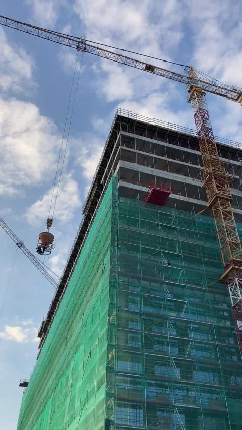 Construction crane on building site building skyscraper with blue sky. Stock Footage 218613111