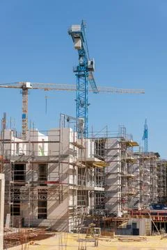 A construction crane on a building site Stock Photos
