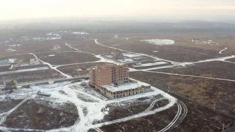 Construction crane builds a new building in the field. Stock Footage 127370795