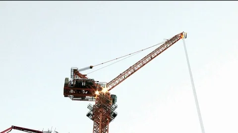 The Construction crane carrying a load Stock Footage 97927923