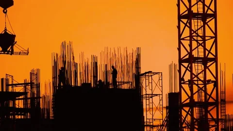 Construction crane, cement pouring worker during the orange light of the sunset. Stock Footage 138992188