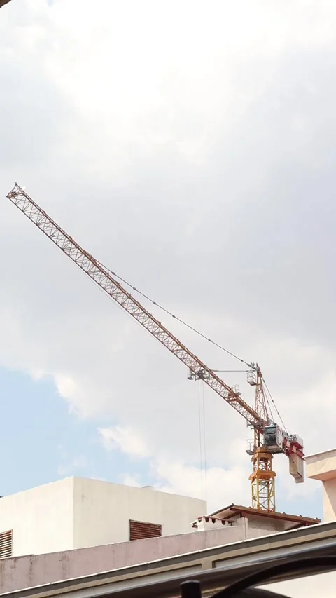 Construction Crane with Clouds in the Background Timelapse (Vertical Video) Stock Footage 322135650