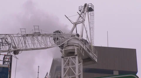 Construction crane collapses during building site fire &amp; accident PT5 Stock Footage 30342552
