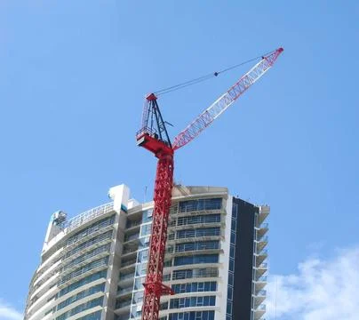 Construction Crane Construction crane working on completion of a building.... Stock Photos