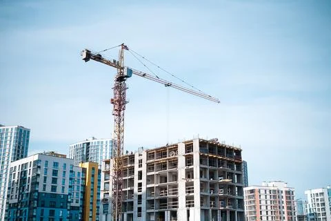 Construction crane in the construction of multi-storey buildings Stock Photos