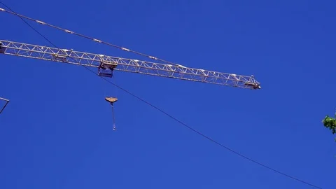 Construction crane at a construction site of a multistory building Stock-Footage 75446702