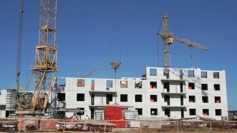 A construction crane delivers the concrete slab Stock Footage 70477113