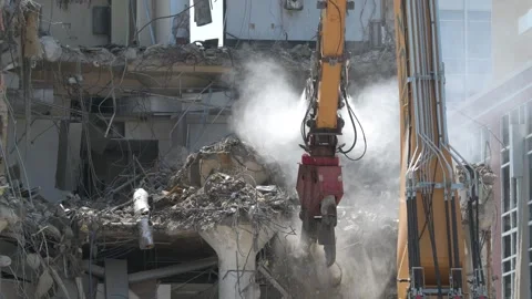 Construction crane demolishing a building to make room for a park. Video stock 250359962